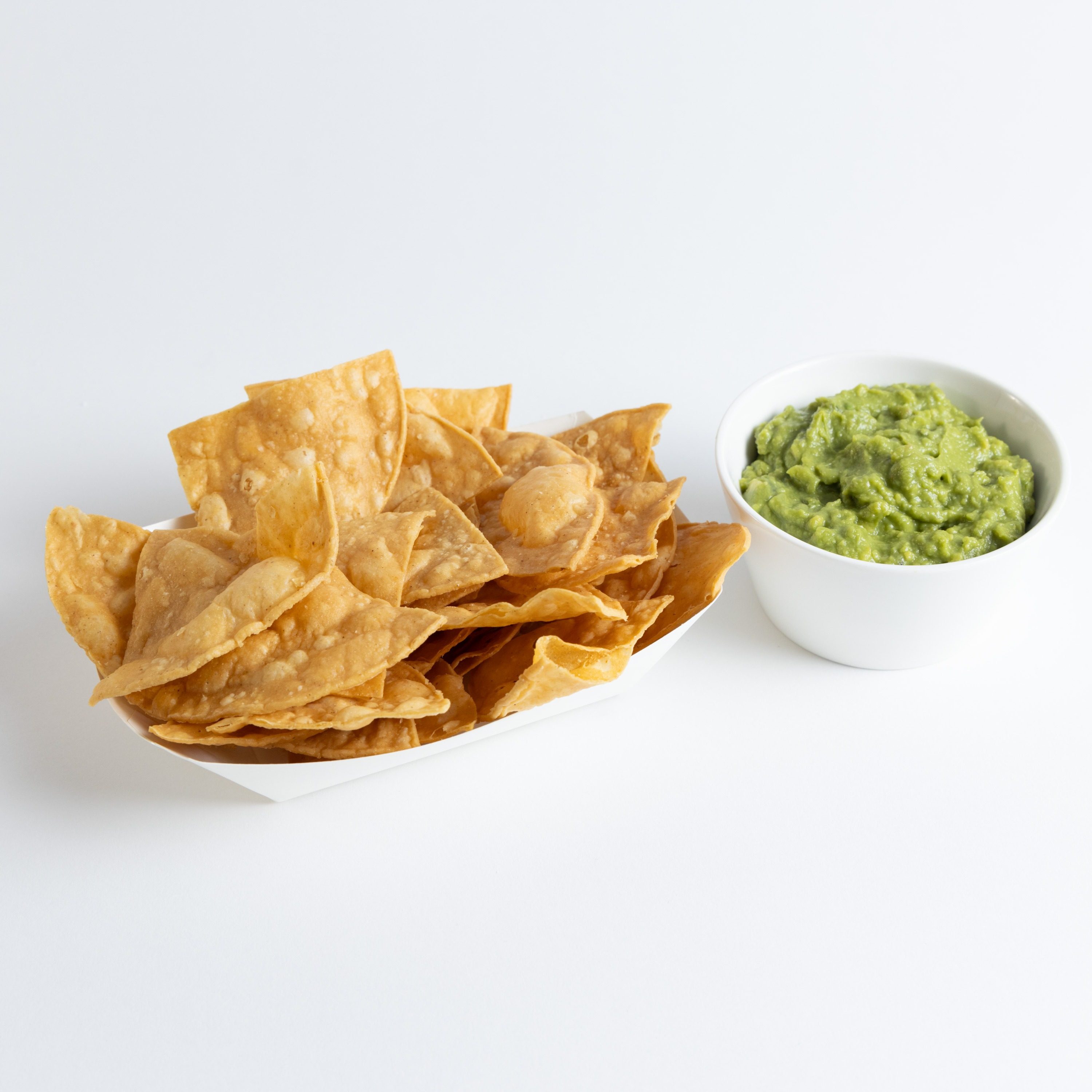 2oz Homemade Guacamole with Chips.